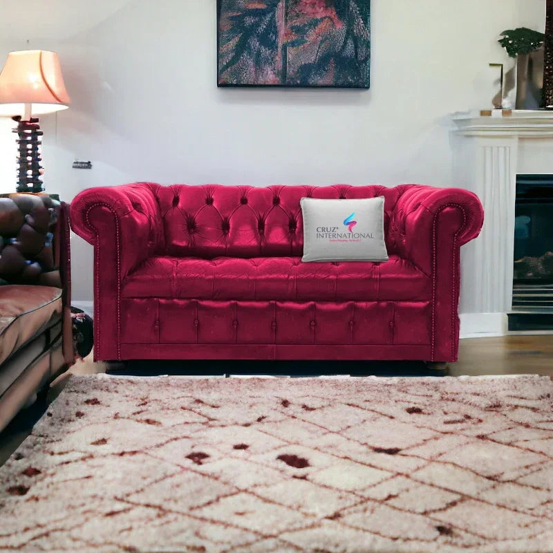 Carrot pink tufted sofa with CRUZ INTERNATIONAL pillow in a stylish living room